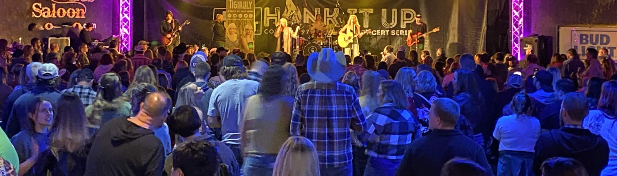 country concert with fans wearing cowboy hats St Louis